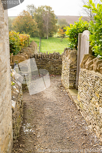 Image of Narrow footpath between cotswold stone walls