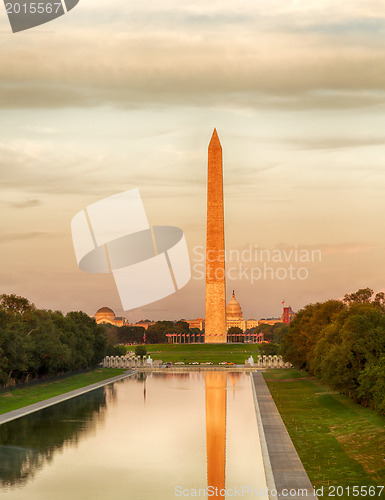 Image of Setting sun on Washington monument reflecting