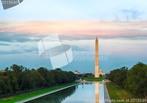 Image of Setting sun on Washington monument reflecting