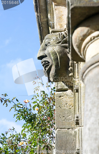 Image of Old gargoyle with ugly open mouth