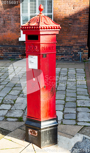 Image of Victoria era red post office mailbox in street