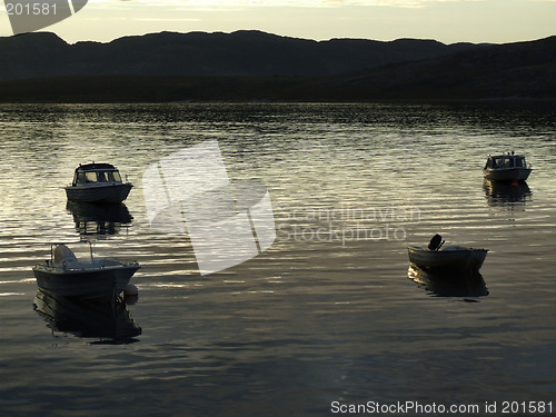 Image of Boats in the light of sunset