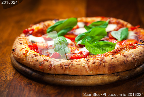 Image of Pizza with salami and mozzarella