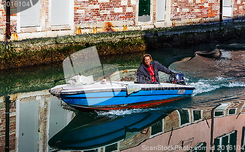 Image of Motorboat on a Small Venetian Canal