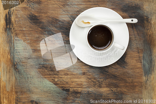 Image of coffee cup on grunge wood