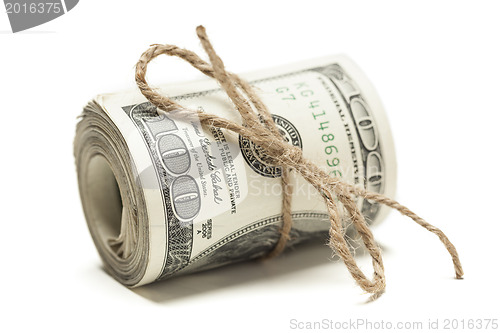 Image of Roll of One Hundred Dollar Bills Tied in Burlap String on White