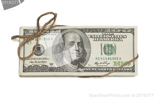 Image of Stack of One Hundred Dollar Bills Tied in a Burlap String on Whi