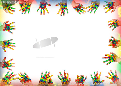 Image of Boy hands painted with colorful paint