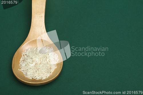 Image of Basmati rice in wooden spoon 