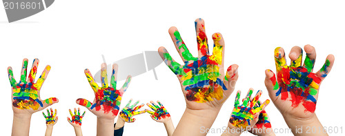 Image of Boy hands painted with colorful paint