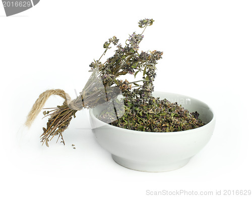Image of Dried thyme in a bowl and thyme twigs