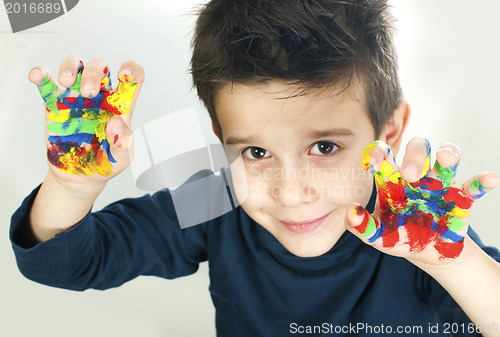 Image of Boy hands painted with colorful paint