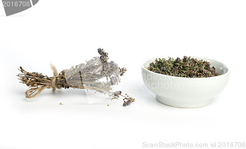 Image of Dried thyme in a bowl and thyme twigs