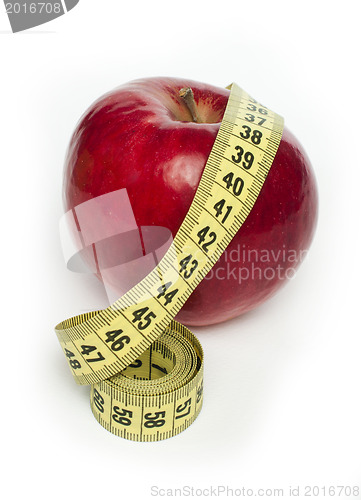 Image of Red apple and centimeter