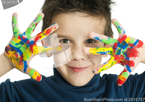 Image of Boy hands painted with colorful paint