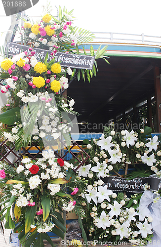 Image of A truck decorated with flowers at the funeral of Phuket's matria