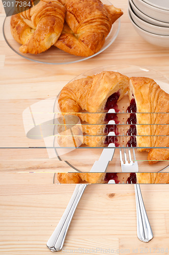 Image of croissant French brioche filled with berries jam