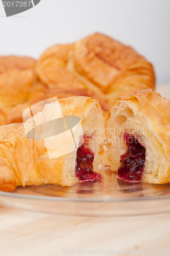 Image of croissant French brioche filled with berries jam