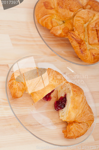 Image of croissant French brioche filled with berries jam