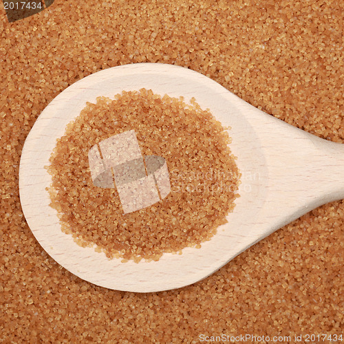 Image of Brown sugar on a wooden spoon