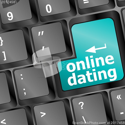 Image of online dating button on computer keyboard showing love concept