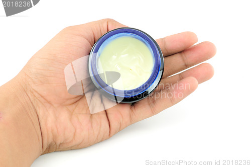 Image of moisturizing cream in the women's hands 