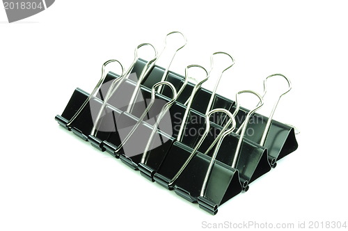 Image of Black metal paperclips on white background 
