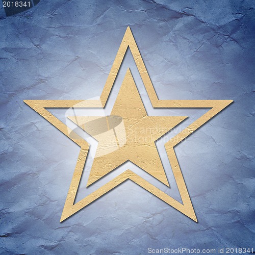 Image of star of paper on background 
