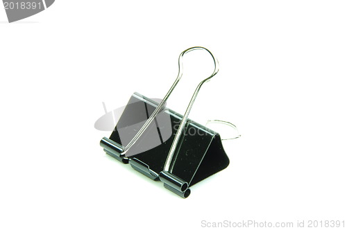 Image of Black metal paperclips on white background 