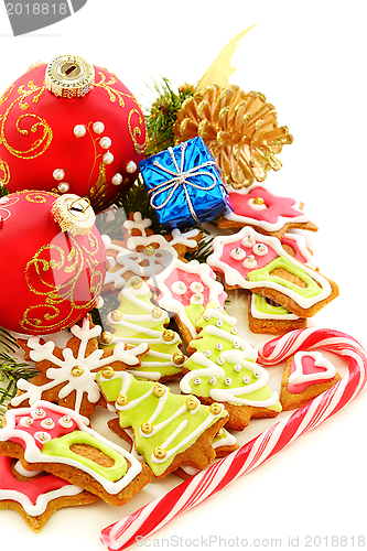 Image of Christmas balls, gingerbread and golden cones.
