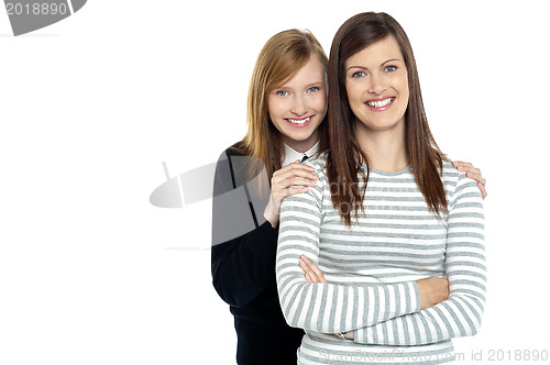 Image of Daughter embracing her mother from behind