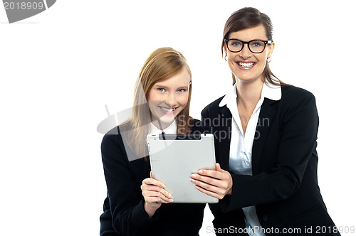 Image of Tutor with student holding portable tablet pc