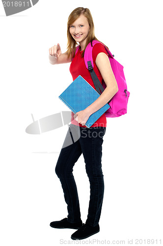 Image of Trendy high school girl pointing at you