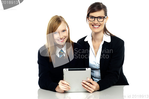 Image of Teacher and student holding tablet device together