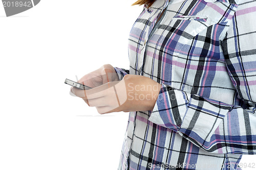 Image of Cropped image of a girl in checked sending messages