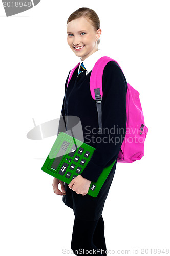 Image of School girl posing with backpack and calculator