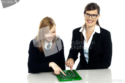 Image of Teacher and student working on calculator