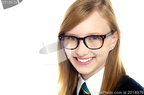 Image of Closeup shot of smiling schoolgirl in eyeglasses