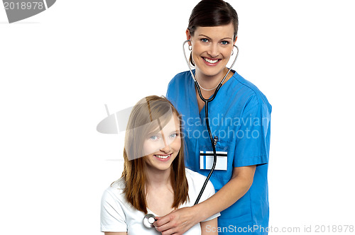 Image of Young patient being examined by a cheerful doctor