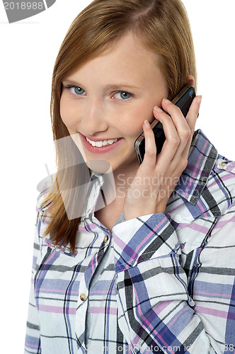 Image of Close up of a pretty girl communicating on phone