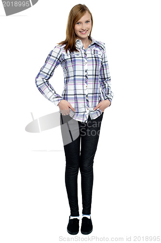 Image of Trendy girl with long hair posing smartly