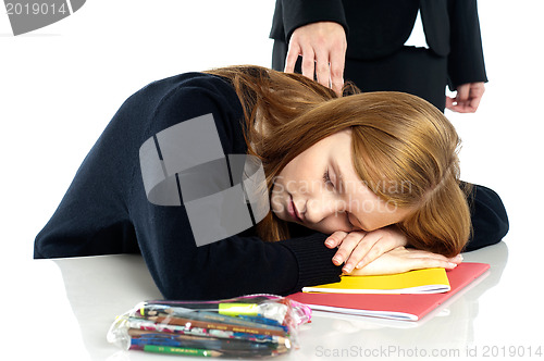 Image of Teacher waking up a dozed off student