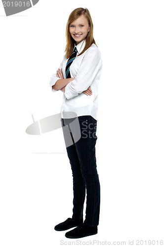 Image of Confident high school girl posing with folded arms