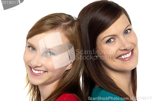 Image of Pretty teenager girl with her mother
