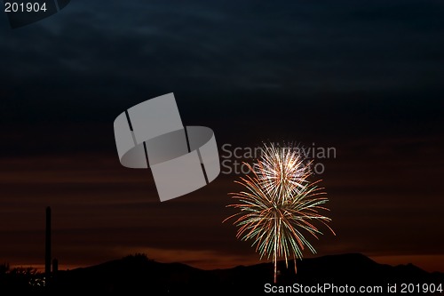 Image of Firecrackers In The Sky During Sunset