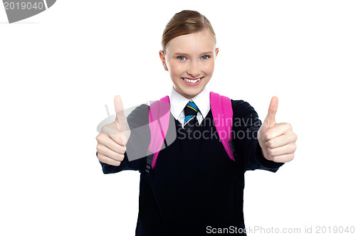 Image of Bright student showing thumbs up sign