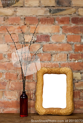 Image of Photo frame and clay bottle with willow catkins