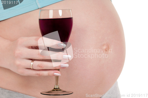 Image of Pregnant belly with wine