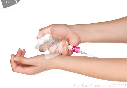 Image of Hand with syringe