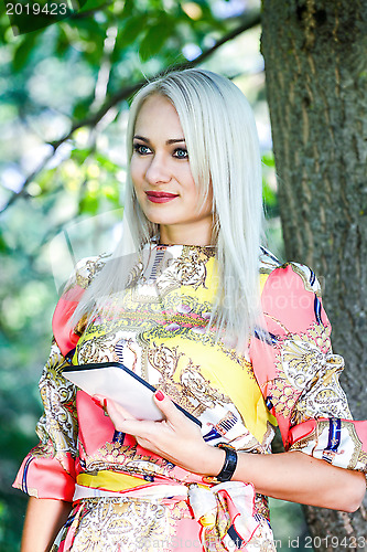 Image of Beautiful girl with a Tablet PC